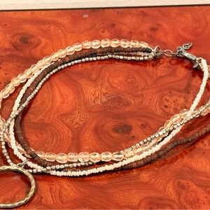 Chic Multi-Strand Necklace with Brown and Cream Beads
